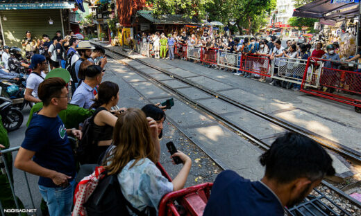 Foreign tourists linger around closed Hanoi Train Street