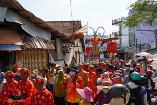 People splash water and smash pots during the Vegetarian festival