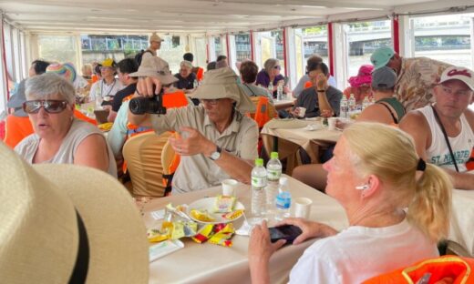 Hundreds of foreign tourists enjoy boat ride in HCMC canal